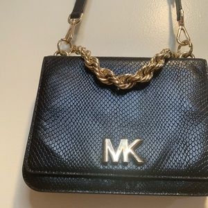 Michael kors purse, can be cross body, black and gold chain